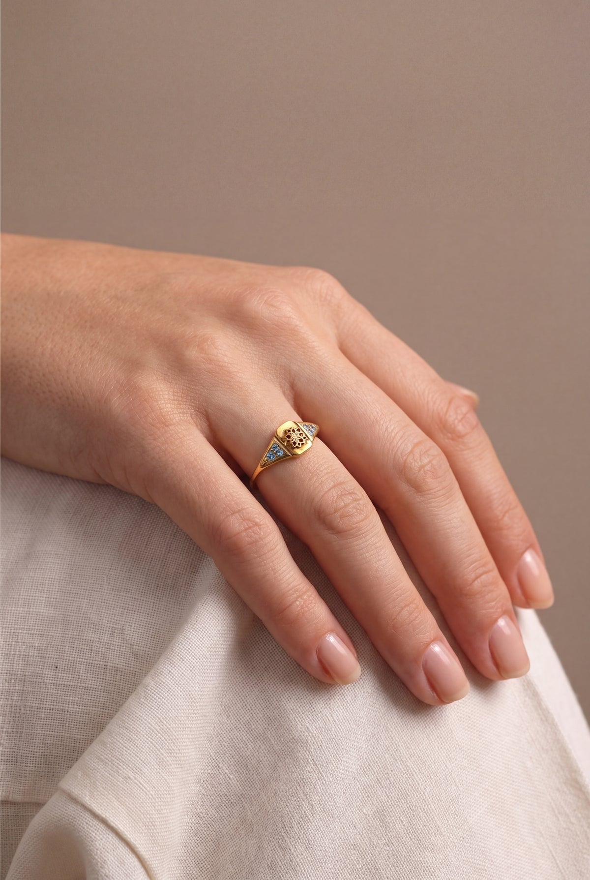 Lotus Engraved Signet Ring with Blue Stones – on model, second view
