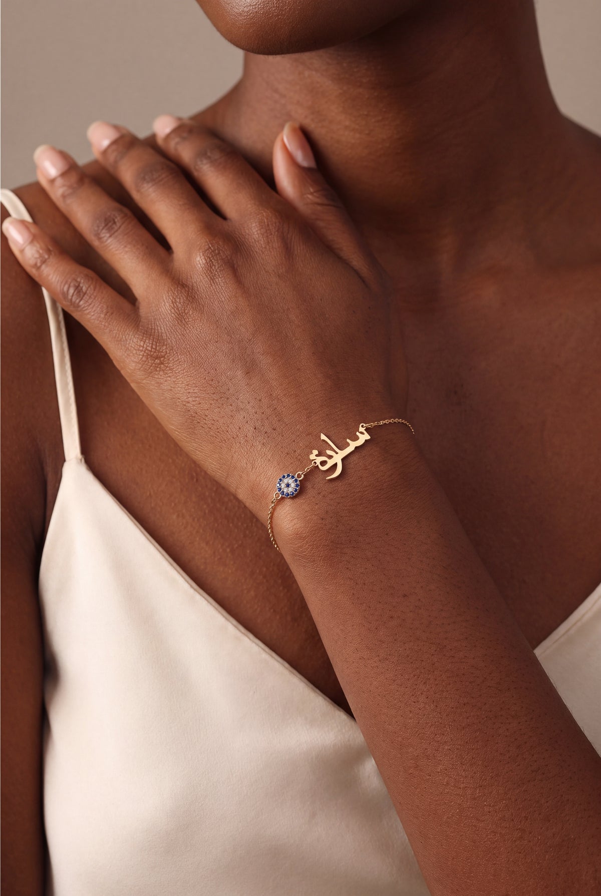 Personalized Arabic Name Bracelet with Evil Eye Charm – on model