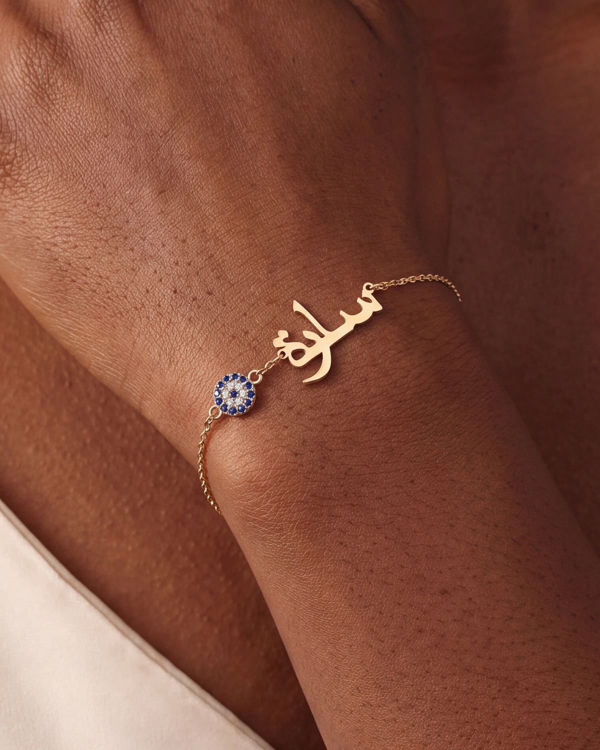 Personalized Arabic Name Bracelet with Evil Eye Charm – close-up