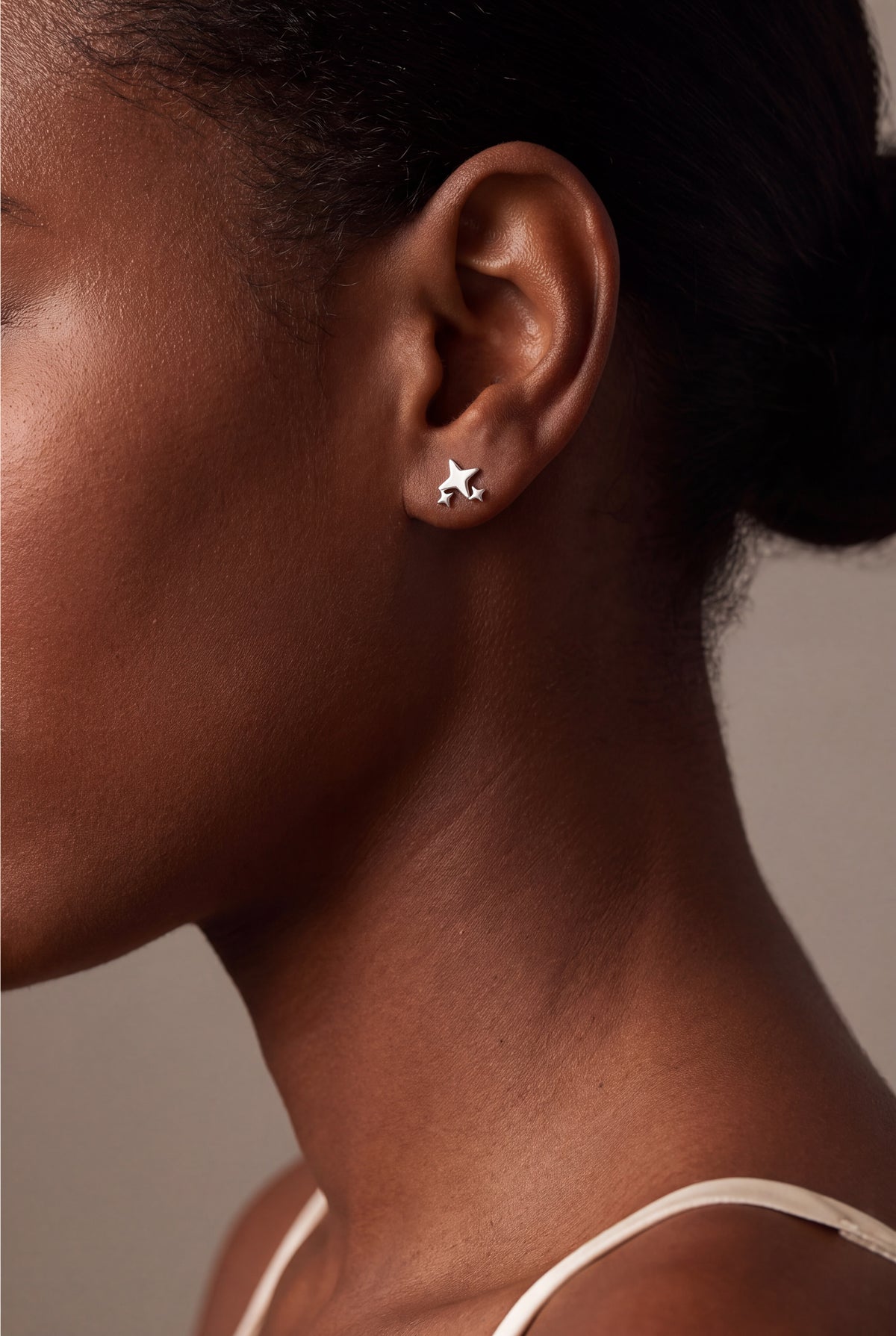 Triple Star Stud Earrings – on model, second view