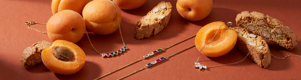 Dainty birthstone necklaces and bracelets with apricots and almond biscotti
