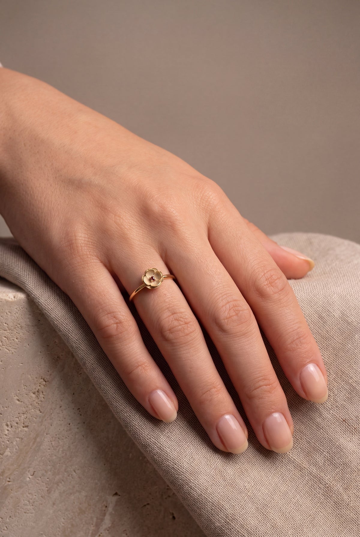 Flower Ring with Red Stone – on model