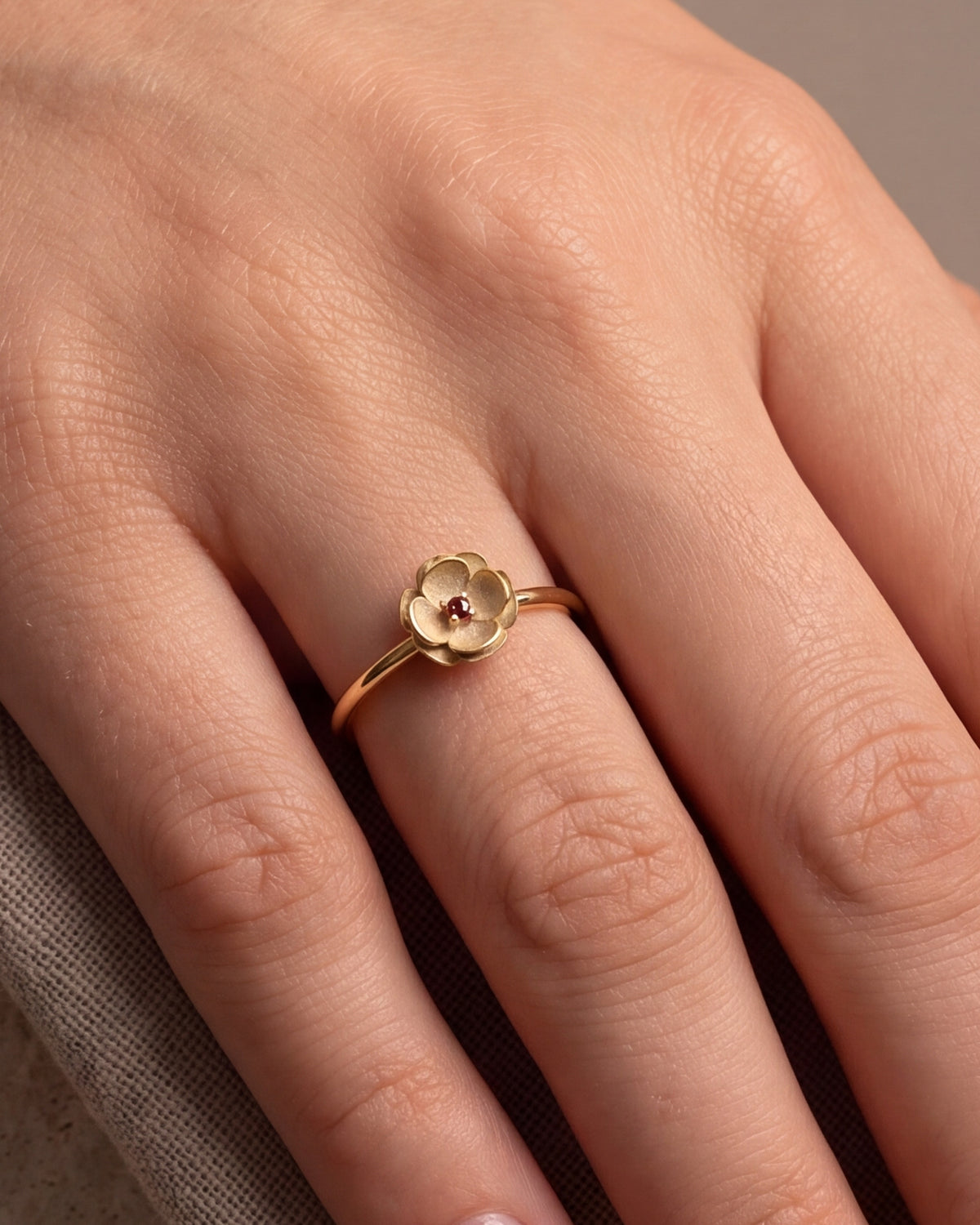 Flower Ring with Red Stone – close-up