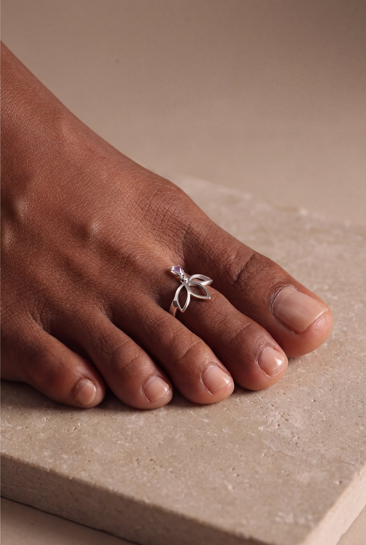 Lotus Toe Ring with Heart Stone Charm – on model, second view