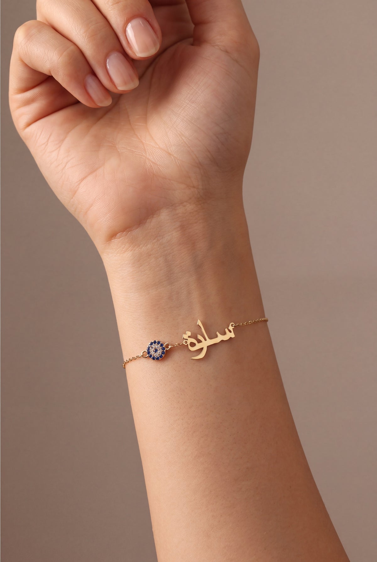 Personalized Arabic Name Bracelet with Evil Eye Charm – on model, second view