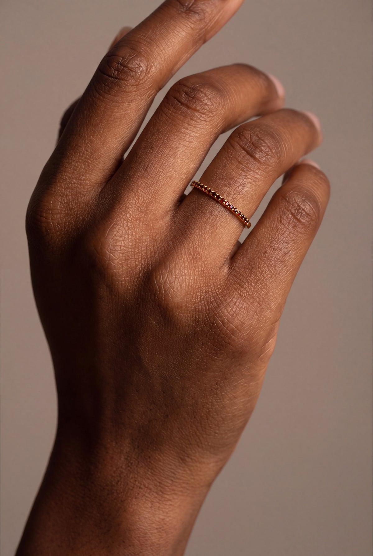 Red Stone Eternity Band Ring – on model, second view